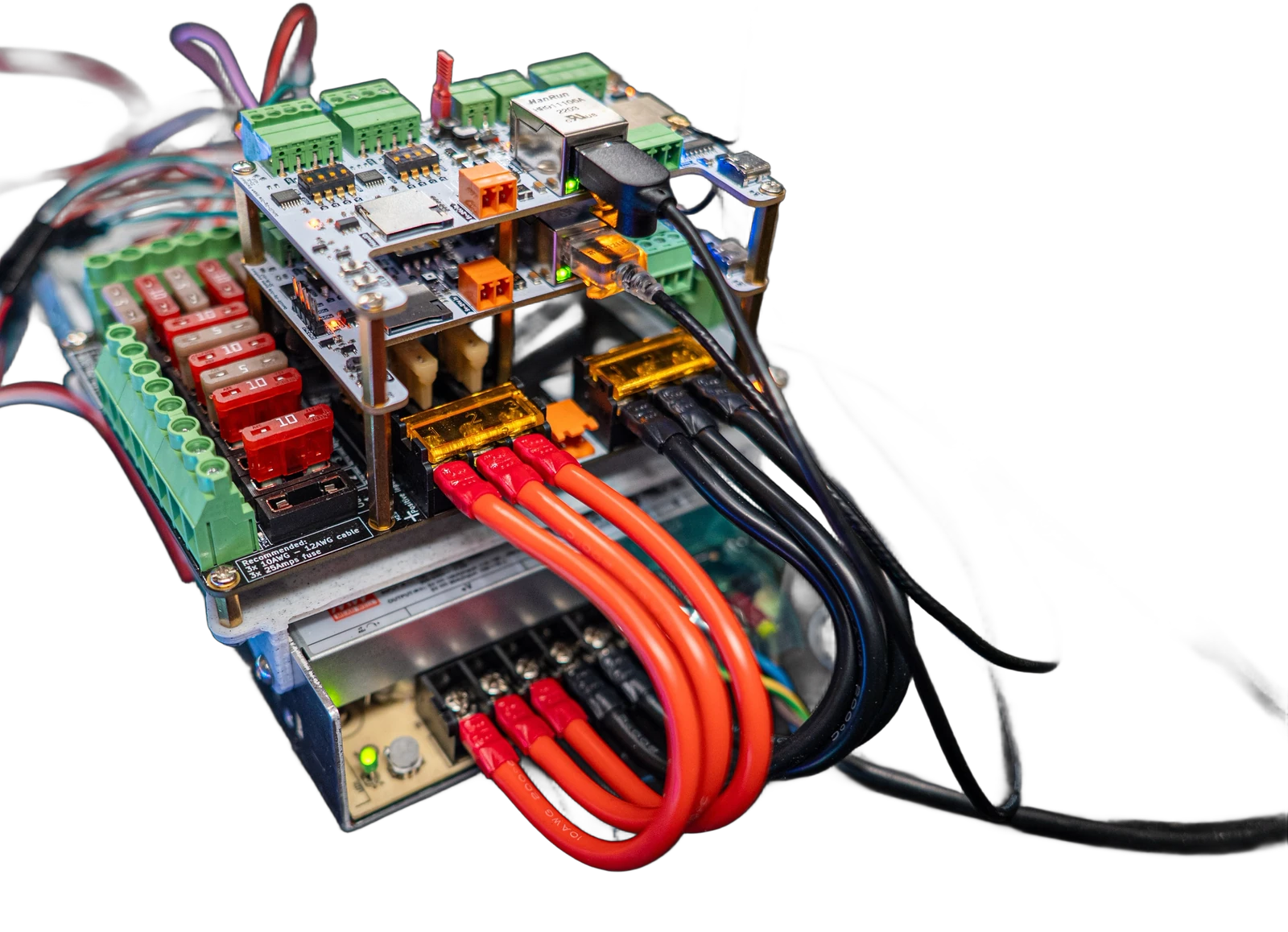 QuinLED Dig-Octa stack bolted on top of a Mean Well LRS power supply, with three thick red and three black wires running from the PSU output terminals into the powerboard's fused barrier inputs